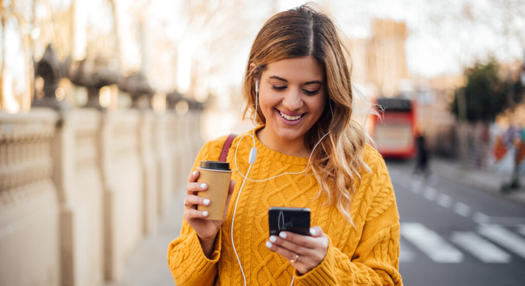 Happy person use their mobile phone