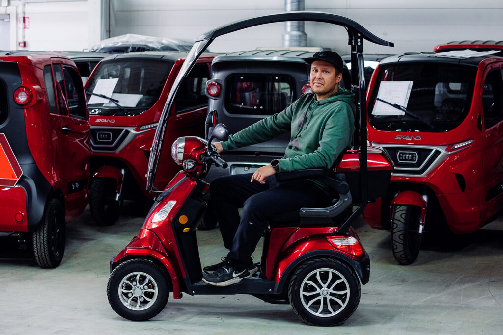 Man sits on a roof equipped LEIJONA 1400 Senior Scooter