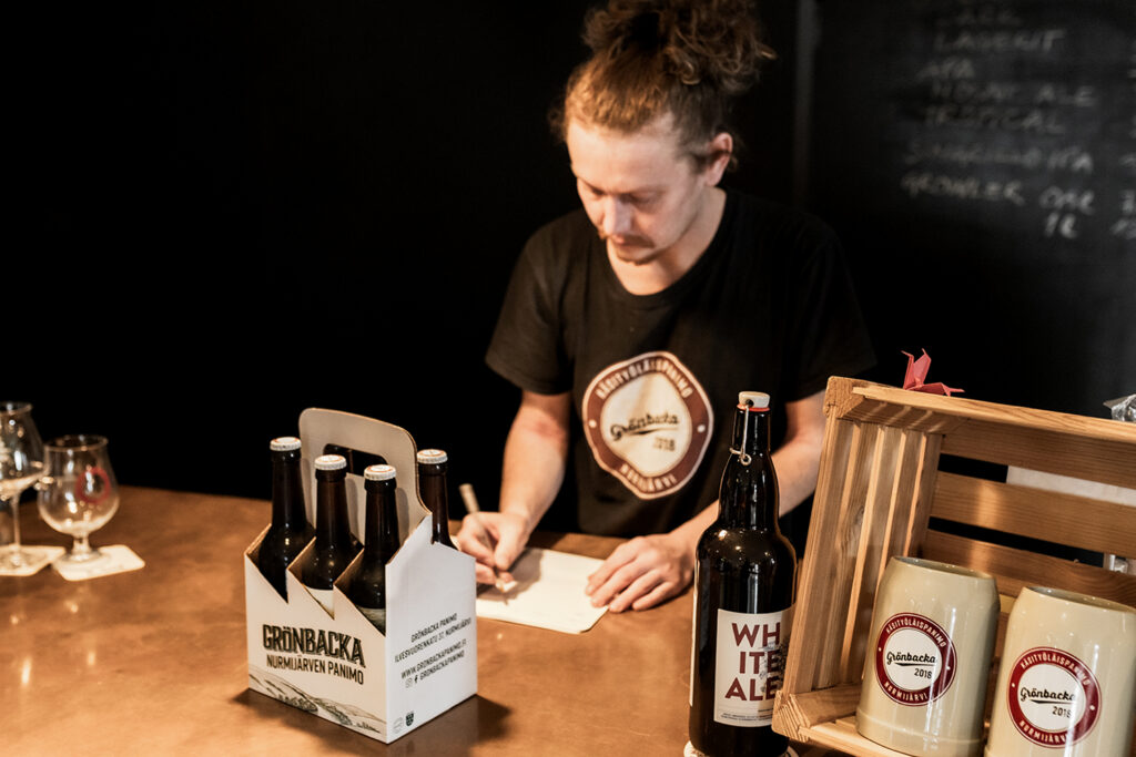 Andreas Wennström behind the counter of the brewery shop.