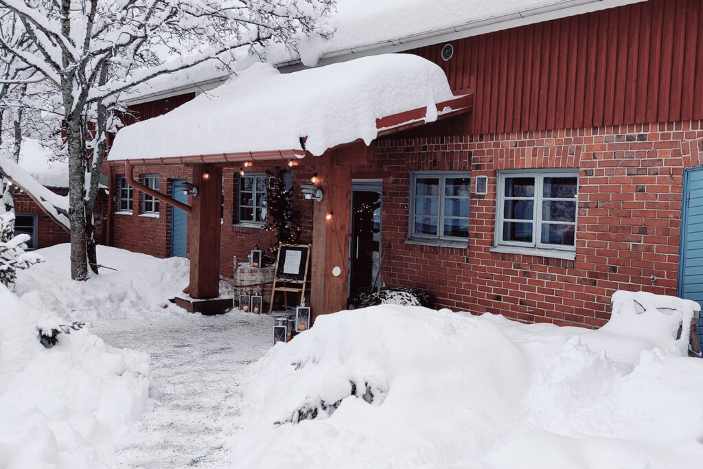 Knehtilä Organic Farm in an atmospheric snow cover. Just 200 meters from this building, there's a field of organic blackcurrant bushes.